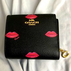 Black Coach wallet with red/pink lips
